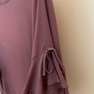 Pink polyester top but feels silky